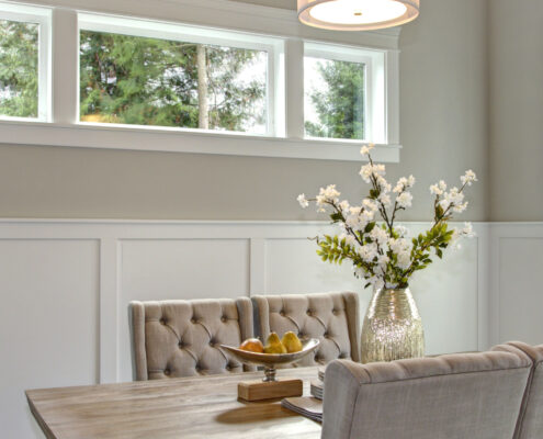 Elegant transitional dining room with board and batten walls