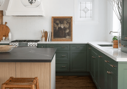 green cabinetry and gold hardware